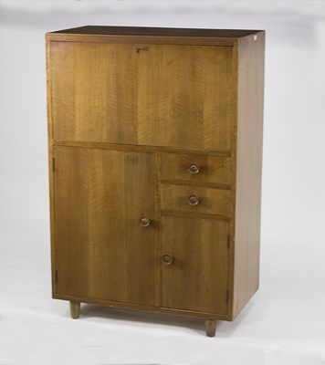 Lot 1024 - A mid-century bureau cabinet, possibly by...