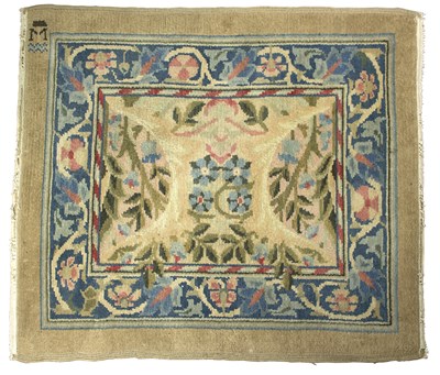 Lot 1033 - A William Morris rug of foliate design within...