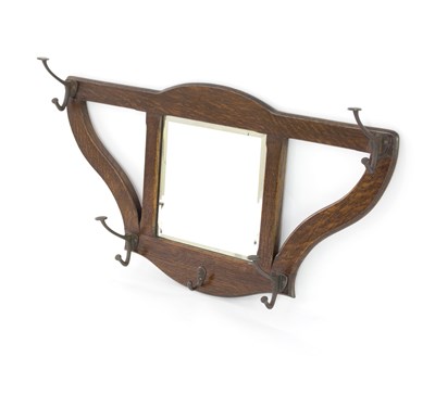 Lot 1043 - An Art Nouveau oak hall mirror in the manner...