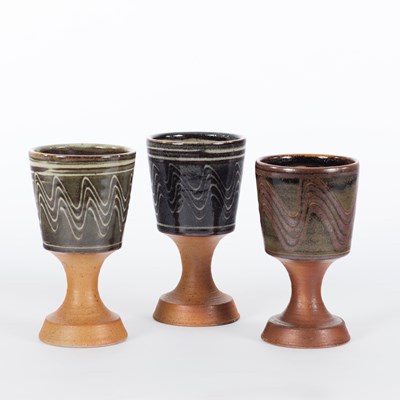 Lot 1056 - Winchcombe Pottery/Three stoneware goblets,...