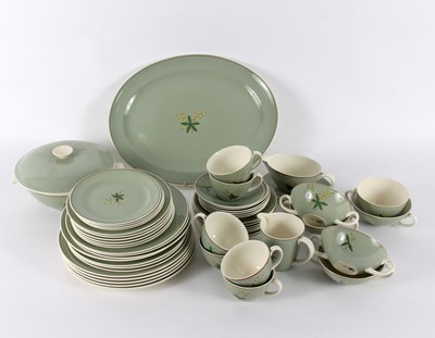 Lot 1072 - A Poole pottery part dinner service, of...