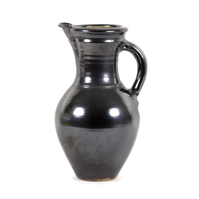 Lot 1076 - A Michael Casson metallic lustre glazed jug of...