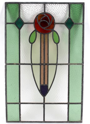 Lot 1093 - A polychrome stained glass panel in the style...