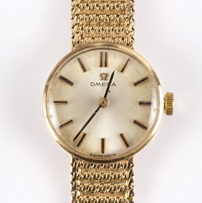 Lot 1101 - A lady's Omega 9ct gold wristwatch, with mesh...