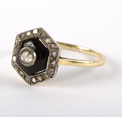 Lot 1145 - An Art Deco diamond and onyx ring, the central...