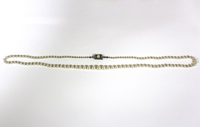 Lot 1152 - A cultured pearl necklace, with single strand...