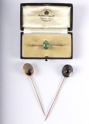 Lot 1157 - A 15ct gold bar brooch set an oval jade...