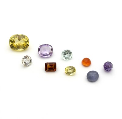 Lot 1164 - A group of loose gemstones, with original...