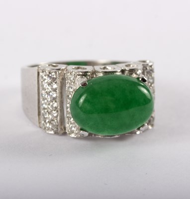 Lot 1168 - A jadeite and diamond set dress ring, the oval...