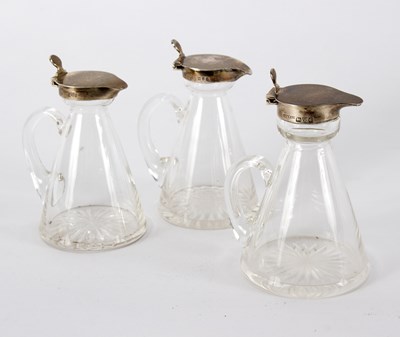 Lot 1465 - A pair of silver mounted whisky toddy jugs, J...