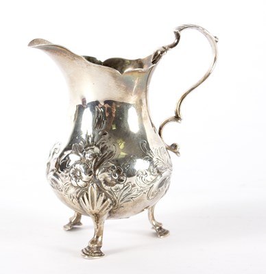 Lot 1471 - A Victorian silver jug, IK, London 1853, on...