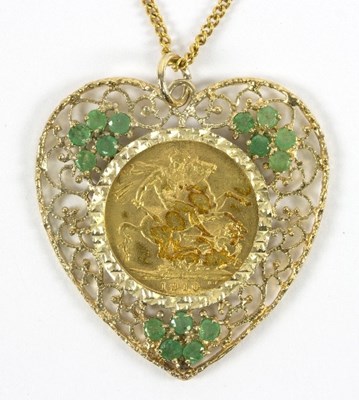 Lot 5 - A 1910 gold sovereign pendant mounted within...