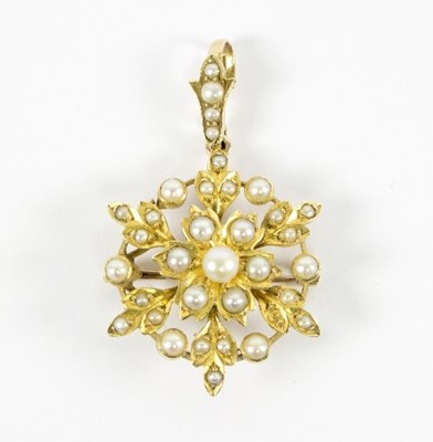 Lot 9 - A seed pearl pendant/brooch of flowerhead form...