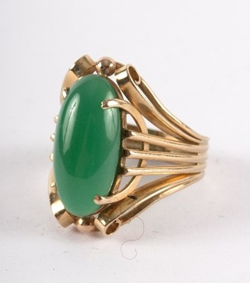 Lot 28 - A chrysoprase ring, the oval stone in a...