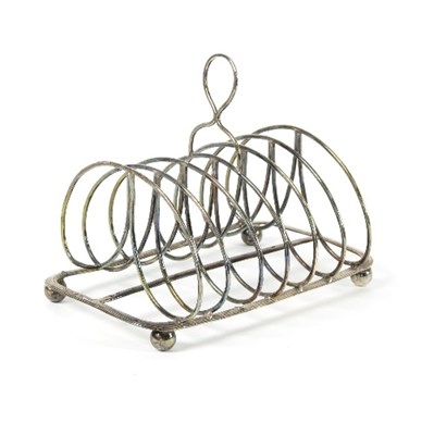 Lot 65 - A George III silver toast rack, SA London 1807,...