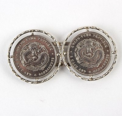 Lot 241 - A white metal buckle set with two Chinese...