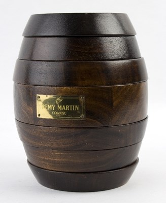 Lot 287 - A Remy Martin oak barrel games compendium of...