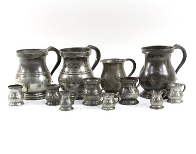 Lot 311 - Three 19th Century pewter bellied measures, 1...