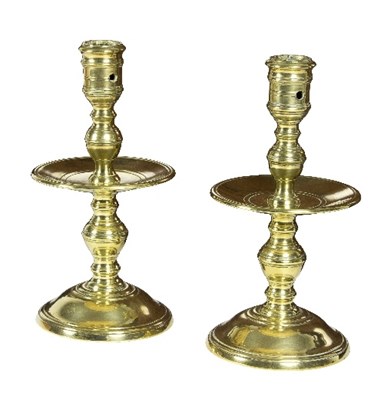 Lot 315 - A pair of Heemskerk brass candlesticks, each...