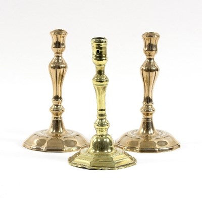 Lot 317 - A pair of mid 18th Century brass candlesticks...