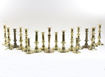 Lot 320 - Eight pairs of 19th Century brass candlesticks,...