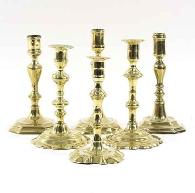 Lot 322 - Six 18th Century and later brass candlesticks,...