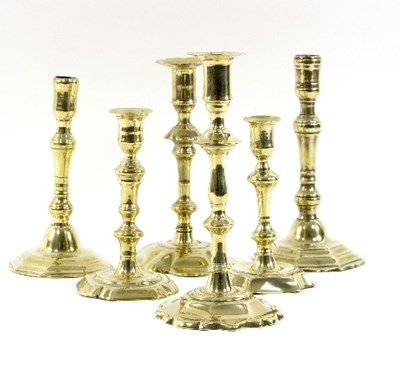 Lot 323 - Six 18th Century and later brass candlesticks,...