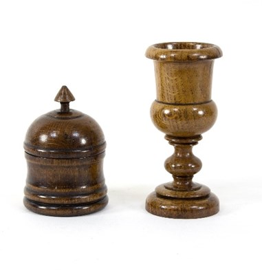 Lot 393 - A turned oak goblet, 20cm high and a turned...