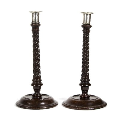 Lot 399 - A pair of George III mahogany candlesticks,...