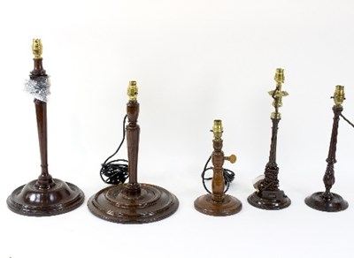 Lot 400 - Two George III fluted mahogany candlesticks,...