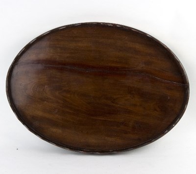 Lot 419 - A 19th Century mahogany oval tray with wavy...