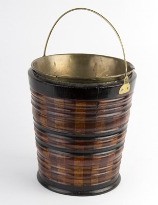 Lot 450 - A turned wood bucket, with bands of ebonised...