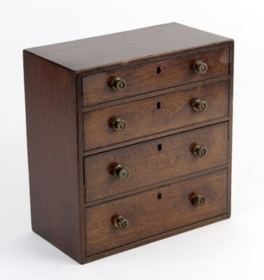 Lot 454 - A 19th Century miniature chest of four drawers,...