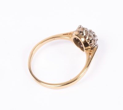 Lot 63 - An 18ct yellow gold and diamond flower head cluster ring