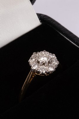 Lot 63 - An 18ct yellow gold and diamond flower head cluster ring