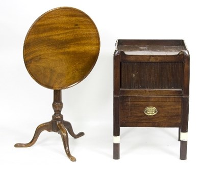 Lot 894 - A mahogany tray-top commode with tambour slide...