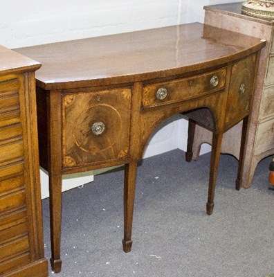 Lot 895 - A Regency mahogany bowfront sideboard, fitted...