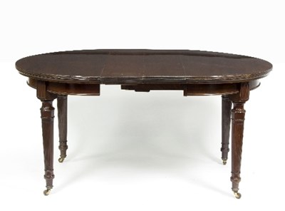 Lot 897 - A mahogany extending dining table with two...