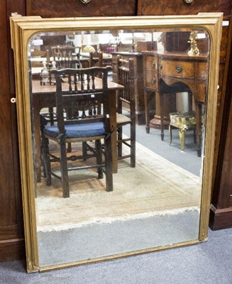 Lot 907 - A giltwood overmantel mirror with moulded...