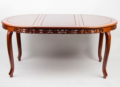 Lot 911 - A Chinese extending dining table carved...