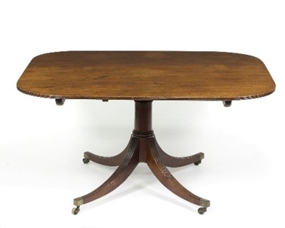 Lot 921 - A 19th Century mahogany tilt-top dining table...