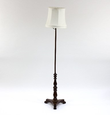 Lot 942 - A mahogany standard lamp on a turned column...