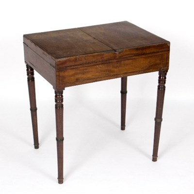 Lot 952 - A mahogany table with linen-fold top, banded...