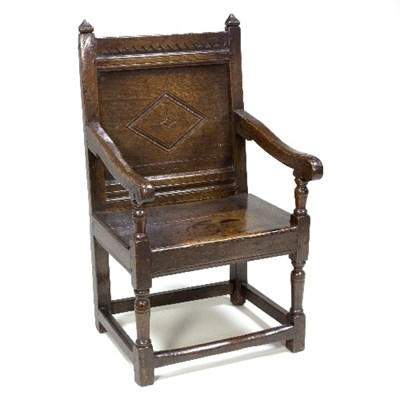 Lot 953 - A 17th Century oak panel back armchair, with...