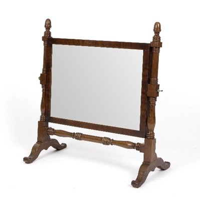 Lot 979 - A mahogany swing frame dressing mirror on a...