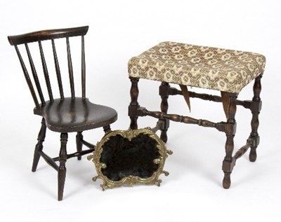 Lot 981 - An upholstered stool on baluster supports,...