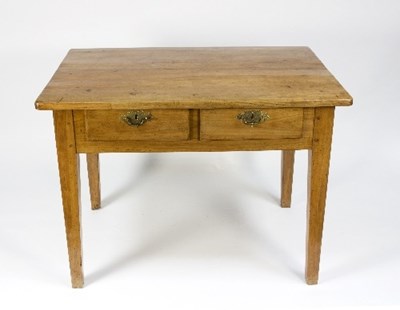 Lot 986 - A rectangular fruitwood table, fitted two...