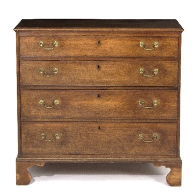 Lot 990 - A George III oak chest of four long drawers,...