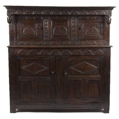 Lot 991 - An oak duodarn, the cornice with inverted...