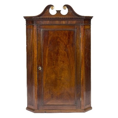 Lot 1001 - A George III mahogany corner cupboard with...